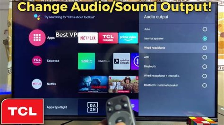 How do I change the audio output on my TV?