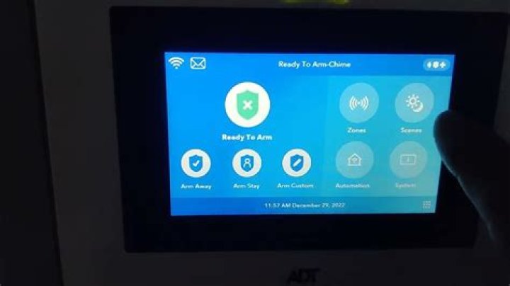 How do I change the code on my ADT alarm system?