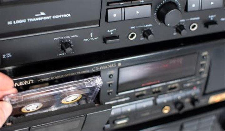 How do I connect my cassette deck to my speakers?
