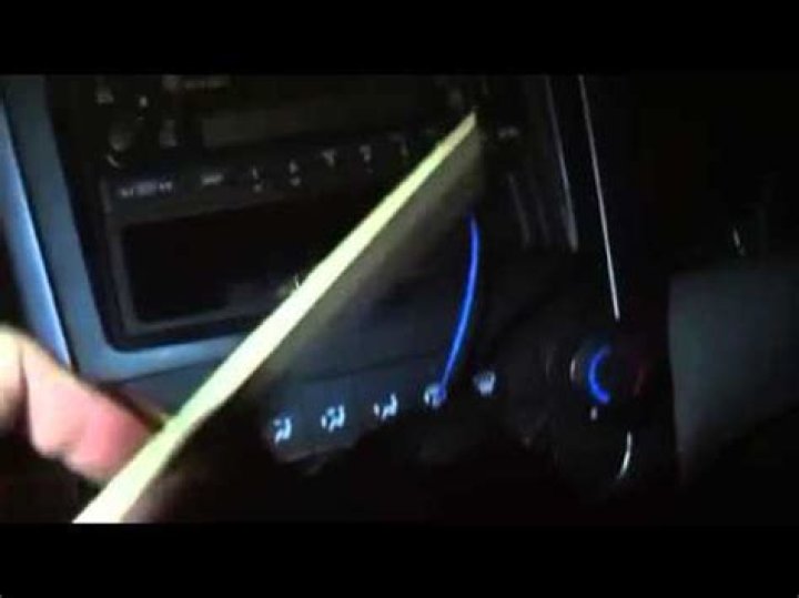 How do I get a stuck CD out of my Bose?