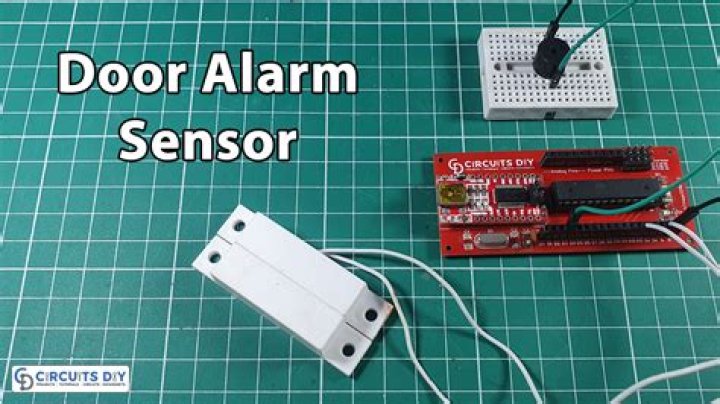 How do I replace a wired door alarm sensor?