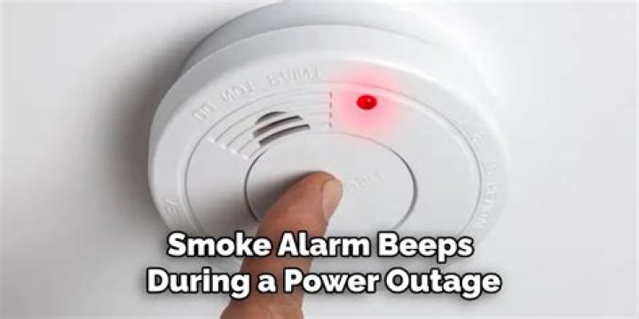 How do I stop my fire alarm from beeping during a power outage?