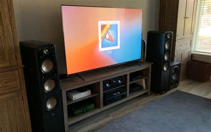 How do I test my Denon surround sound?