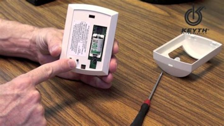How do you remove battery from alarm sensor?
