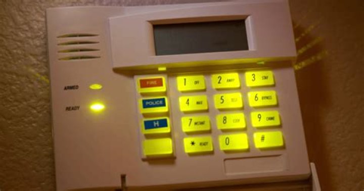 How do you reset the trouble light on a DSC alarm?