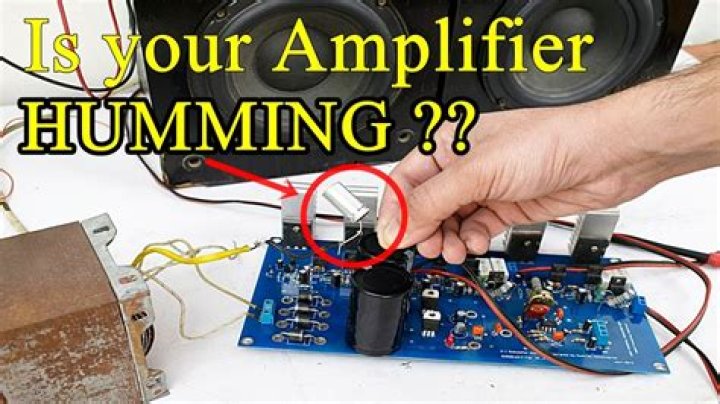 What causes humming in amplifier?