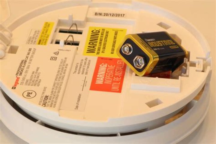 What happens if you press the button on a smoke detector?