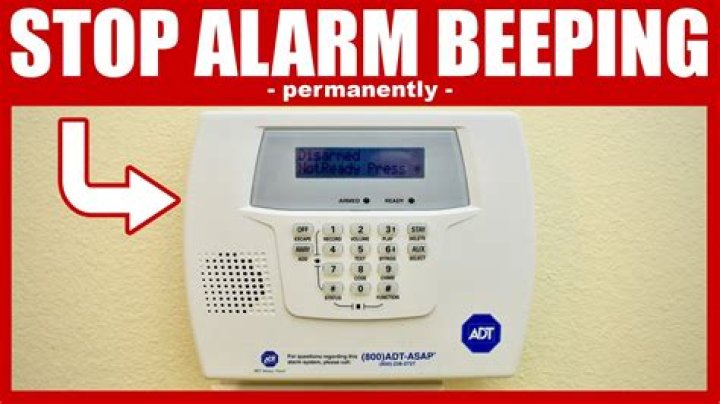 Why does my alarm system keep beeping and flashing?